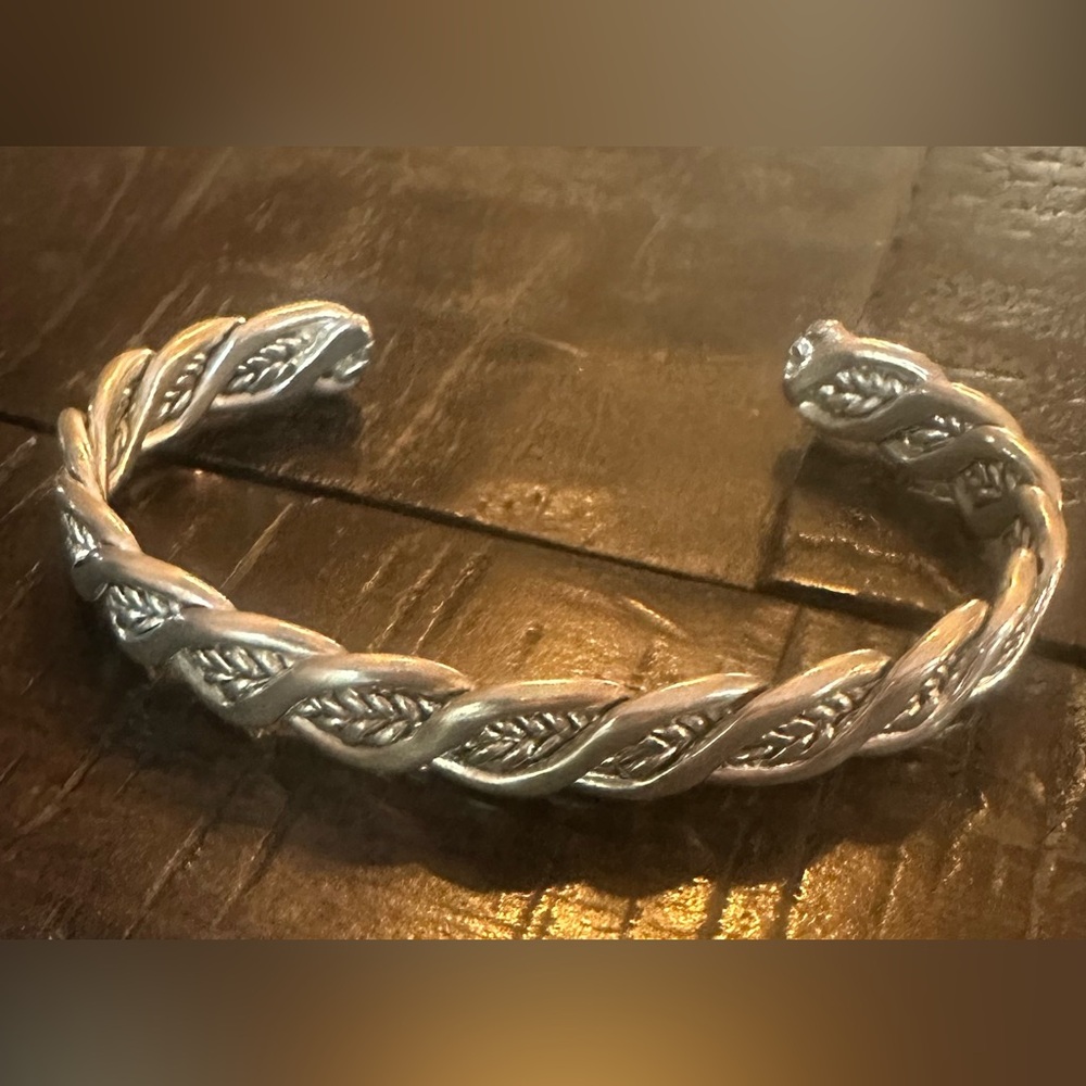 Silver cuff bracelet with sort of feather weave throughout